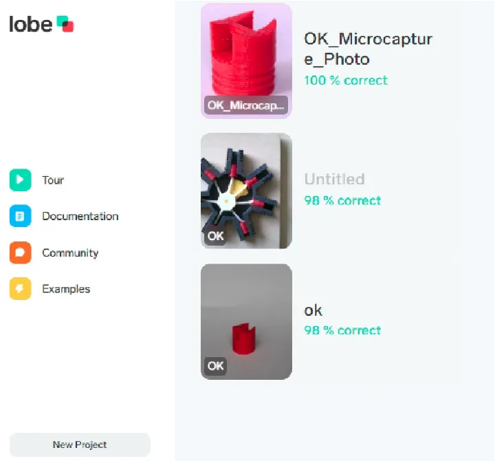 Projektübersicht in Lobe: drei trainierte Modelle mit 98–100 % korrekten Vorhersagen. Quelle: Screenshot aus Lobe (Microsoft). Lobe-Projektübersicht mit drei Modellen: Makroaufnahme eines roten 3-D-Drucks (100 % korrekt), Sternmotor (98 %) und Bauteil (98 %)
